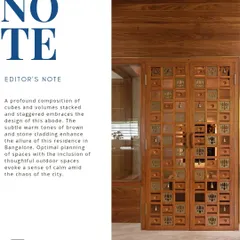An editorial feature of the Cube House, highlighting its main entrance. The custom wooden door with bell details and the composition of stacked volumes showcase our attention to detail and form.
