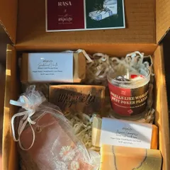 Inside the Divinity Gift Box, a collaboration with Rasa Home. This hamper includes our artisan soaps, a wax sachet, and a "Smells Like World's Best Poker Player" candle, making it a fun and luxurious gift.