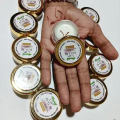 Holding my Saffron Lip Balm, you can see the real saffron strands that I use. This balm is made to solve problems like dry, chapped lips and darkness caused by sun tan or chemical lipsticks. It's pure and safe for everyone.