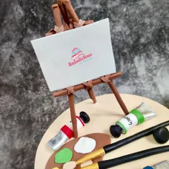 I even added my own little logo to the edible canvas on this artist-themed cake.