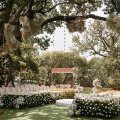 An expansive view of Aashna and Armaan's garden ceremony. The layout was designed to be inclusive, with a circular floral aisle and comfortable lounge seating, ensuring every guest had a perfect view of the vows.
