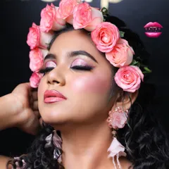 A serene close-up showcasing the delicate pink eyeshadow and glossy lips. This look is perfect for a bride who wants something soft, romantic, and modern.
