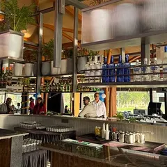 The bar area overlooking the golf course. Our design ensures that the interior landscape feels connected to the exterior, blurring the lines between the built and natural environments for a seamless guest experience.