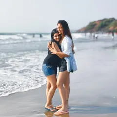 A candid portrait of two friends on a beach in Goa, shot on the Oppo Reno 11 Series. This shows my ability to capture natural, emotional moments that highlight a phone's portrait mode capabilities.