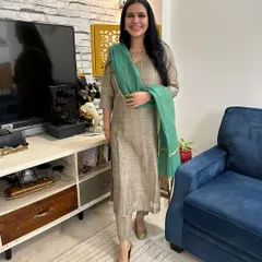 My favorite accessory is often a simple, elegant necklace that complements the outfit without overpowering it, like this one paired with a suit made from an upcycled dupatta.