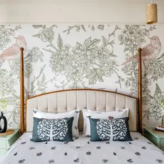 Sometimes, all a bedroom needs is a touch of charm. We introduced this beautiful bird Chinoiserie wallpaper behind the bed to add character without overwhelming the room's simple, calming design.