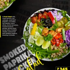 Fuel your grind with our Smoked Paprika Chicken Salad. This fresh salad features mixed greens, red cabbage, bell peppers, and smoked chicken, all tossed in a jalapeno yogurt dressing for a smoky and spicy kick.