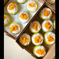 Celebrating mango season with these delicious mango cupcakes. Each one is topped with fresh, juicy Alphonso mango pieces.