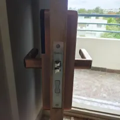This side view shows the robust mortise and internal mechanics of the Qubo smart lock after installation. The solid construction provides reliable security for your main entrance.