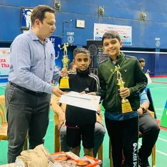 Adhiraj Shetty from our Chembur Gymkhana centre proudly receives his trophies after winning Gold in U11 Boys' Doubles and Bronze in U11 Boys' Singles at the Maharashtra Mini State Badminton Championship.