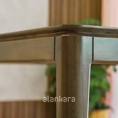 A close-up of the Zircon table's corner, revealing the precision of the joinery and the smooth, rounded edges. I personally inspect every detail to ensure a flawless finish.