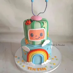 This two-tier Cocomelon cake was designed for a little fan. I recreated the iconic melon TV and rainbow from the show, making it a bright and cheerful centerpiece for a toddler's party.
