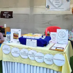 My stall setup, proudly displaying my brand's promises: 100% Natural, Handmade, Palm Oil Free, and more.