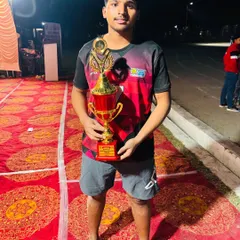 Another one of our promising young players with the first-place trophy from the Meerut tournament.