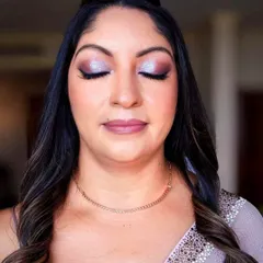 A close up of the beautiful and graceful groom's mother. The shimmery eyeshadow brightens her eyes, and the skin looks smooth and radiant.