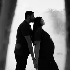 There is so much beauty in simplicity. This black and white silhouette captures a quiet, intimate moment between partners, focusing on your connection and the beautiful shape of your growing family.