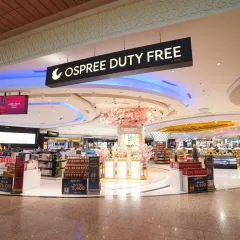An expansive view of the Ospree Duty-Free store, showcasing its open layout and prominent branding. This type of architectural photograph is essential for marketing large commercial venues and highlighting their scale.