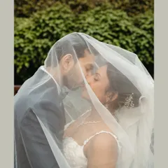 Some moments are so tender they need to be whispered. Sheltered beneath the veil, this quiet kiss during a beautiful Catholic garden wedding is a perfect example of the intimate, soulful memories I promise to capture for you.