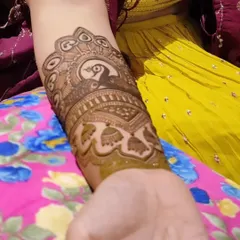 A stunning bridal arm band featuring a peacock at its center. The details in the feathers and the surrounding patterns are what make this piece so special.