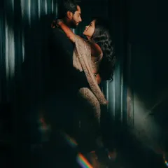 Another artistic shot from the same series, with the prism effect creating a beautiful, ethereal glow around the couple.