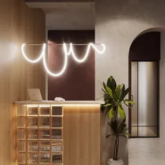 This is the reception area I designed, intended to make a strong first impression. Key features include a custom-designed neon light fixture, a front desk constructed from glass blocks and light wood, and an arched entryway leading further into the office.