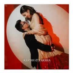 A dramatic and romantic lift against a spotlight. This studio-style shot adds a touch of cinematic flair to the couple's pre-wedding album, highlighting their chemistry.