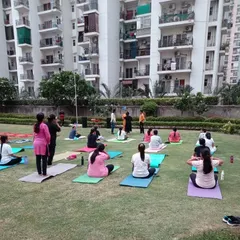 Participants settling into their practice during our community yoga event. We welcome everyone, from beginners to experienced yogis, to join our sessions.