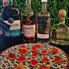 An example of our molecular cocktails. These are edible jellies and spheres that capture the essence of a cocktail in a single bite, served alongside premium spirits like Glenfiddich and Patron.