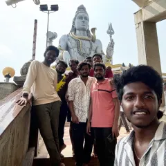 A selfie with the boys in front of the world's second-tallest Shiva statue at Murudeshwara. This is a key highlight of our coastal Karnataka tour.