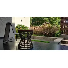 A quiet corner for relaxation, where a modern deck chair overlooks a bed of ornamental grasses. We design these small, intimate moments within the larger landscape for personal retreat.