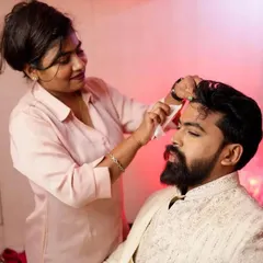 Here I am doing a final touch-up on the groom before his ceremony. A little bit of product goes a long way in making sure he looks his best.