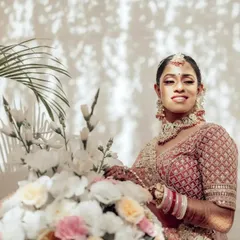 A beautiful sun-dappled portrait of Nupur. The play of light and shadow adds a lovely, natural feel to this candid bridal shot.