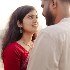 The quiet moments are often the most powerful. This is a candid close-up portrait, focusing on the gentle look shared between the couple during their pre-wedding session in Mumbai.