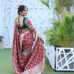 The same happy customer showing the back of the outfit, with the beautiful blouse and hairstyle.