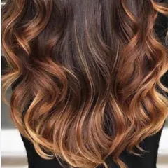 This is our popular caramel balayage. We hand-paint highlights to create a warm, sun-kissed effect that looks natural and grows out beautifully.