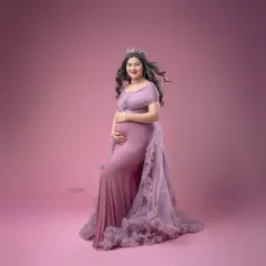 This ruffled lavender gown creates a soft, romantic feel. I use a matching pink backdrop to create a gentle, monochromatic look that is both modern and timeless.