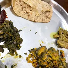 A client's plate with roti, bitter gourd sabzi, and mushroom curry, proving that variety and managing conditions like diabetes can coexist deliciously.
