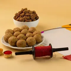 A clean and festive shot styled for Makar Sankranti. I arranged traditional sweets like til ladoo and gajak with props like a kite and thread spool to create a culturally relevant and appealing image for seasonal marketing.