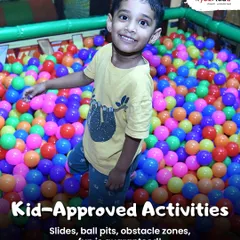 Look at that smile! My indoor play area is packed with kid-approved activities, including this giant, colorful ball pit that guarantees hours of fun. It's a safe and exciting space where kids can just be kids.