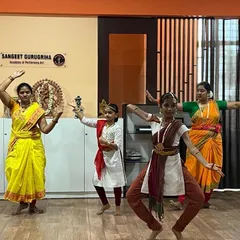 A group of students practicing a Bharatanatyam piece. The aramandi (half-seated posture) is fundamental to this dance style, and our students work hard to master it.