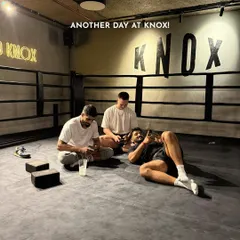 Another day at Knox. After a tough workout, members relax and hang out in the boxing ring, showcasing the community and social aspect of our studio.