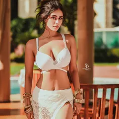 For this high-fashion swimwear shoot, the focus was on creating a bold and confident look. The clean lines of the white two-piece contrast with the warm, natural setting, resulting in a striking and modern fashion statement.