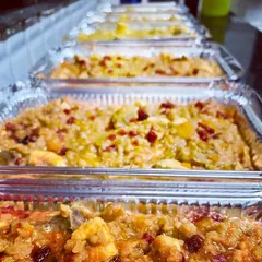 A look at our meal prep process. We prepare food in large, convenient foil containers, perfect for feeders who look after multiple dogs. You can pick up your order or ask about our free local delivery.