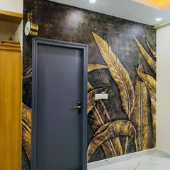 I love creating designs that have depth and texture. This 3D-effect wallpaper with golden leaves adds a touch of luxury and drama to this entryway, making a bold statement right from the entrance.