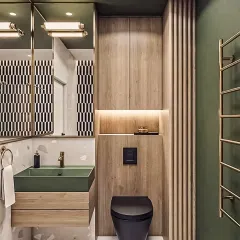 This compact bathroom makes a bold statement with its green vessel sink and matte black fixtures. The design combines wood paneling, patterned tiles, and smart vertical storage to maximize style in a small space.