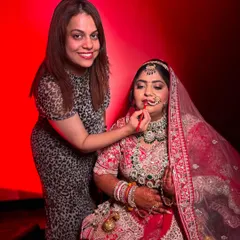 A smiling moment with my bride Dipika as I apply her lipstick. Being a part of these happy getting-ready moments is a privilege.