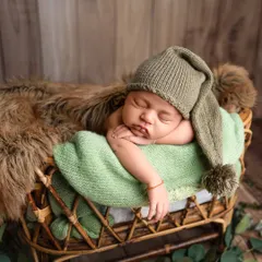 To the most gorgeous little boy. I love using earthy tones like green, which complement a rustic wooden backdrop and bring a natural feel to the portrait.