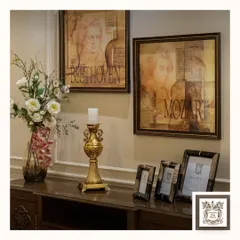 This antique-inspired golden candle stand brings warmth and sophistication to this console table. Paired with classical art, it helps create a regal and timeless ambiance.