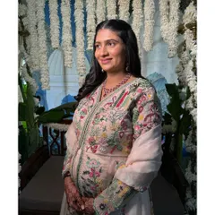 Another lovely shot from her baby shower. She looks so serene and happy, and her skin is absolutely glowing.