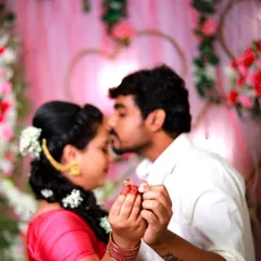 A close-up shot focusing on the couple's hands and engagement rings. This is a classic and meaningful photo that symbolizes their commitment.
